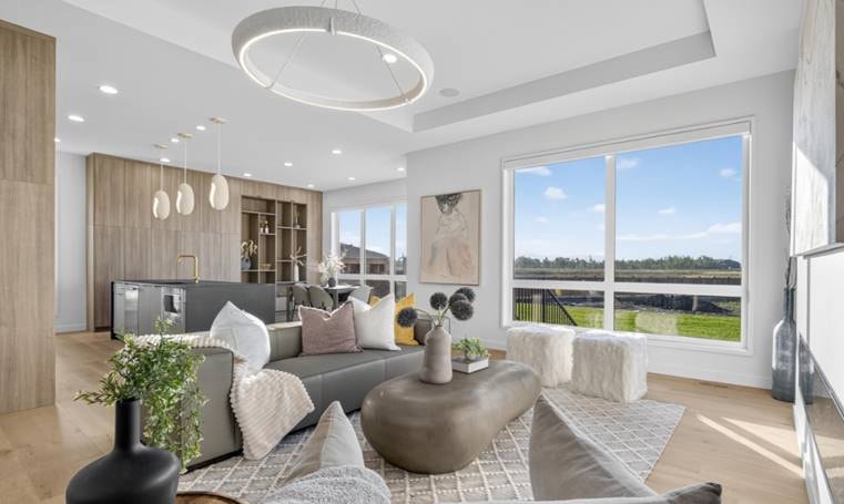 Bright open-concept living room with circular LED chandelier and organic pendant lights