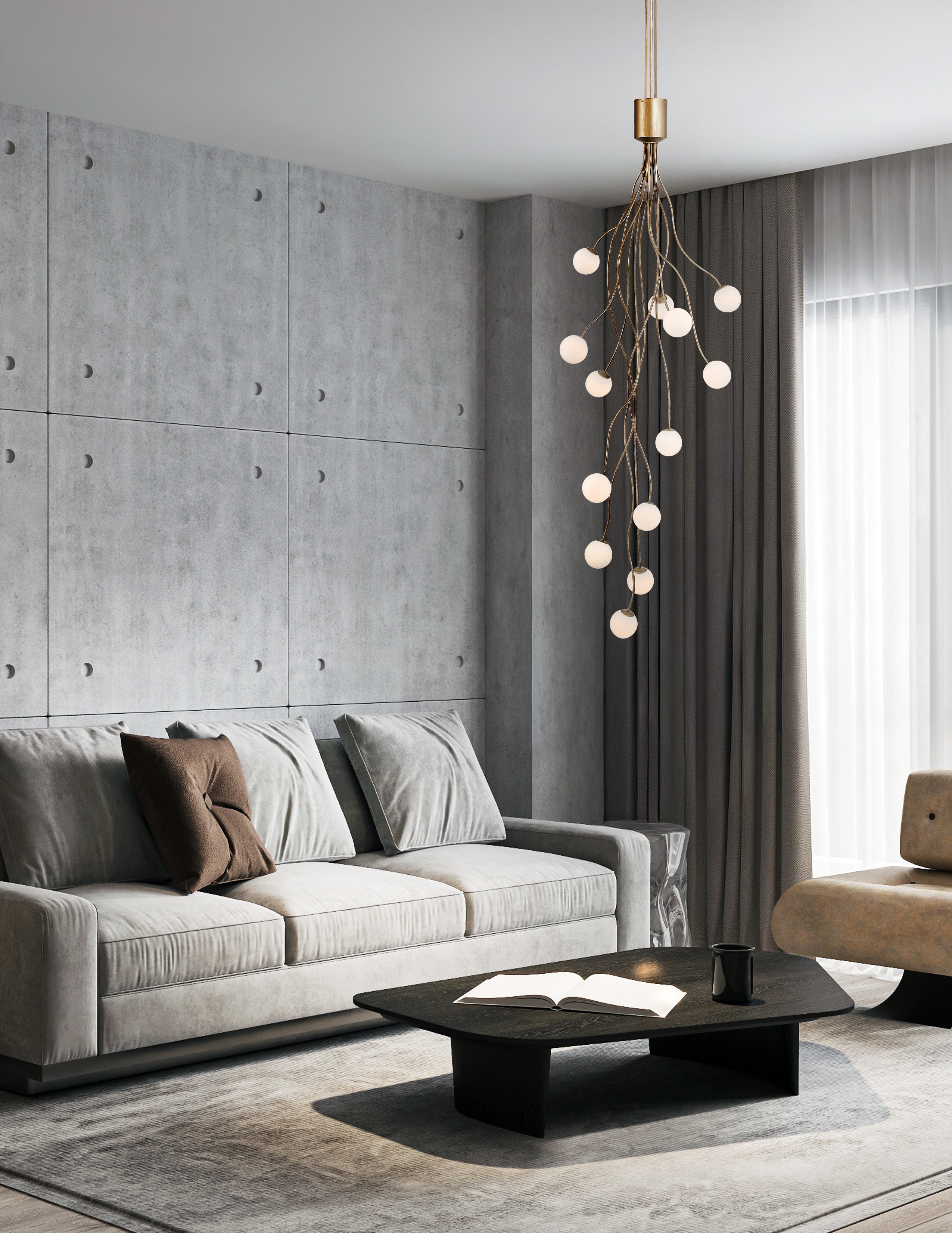 Contemporary living room with concrete walls and cascading brass pendant light